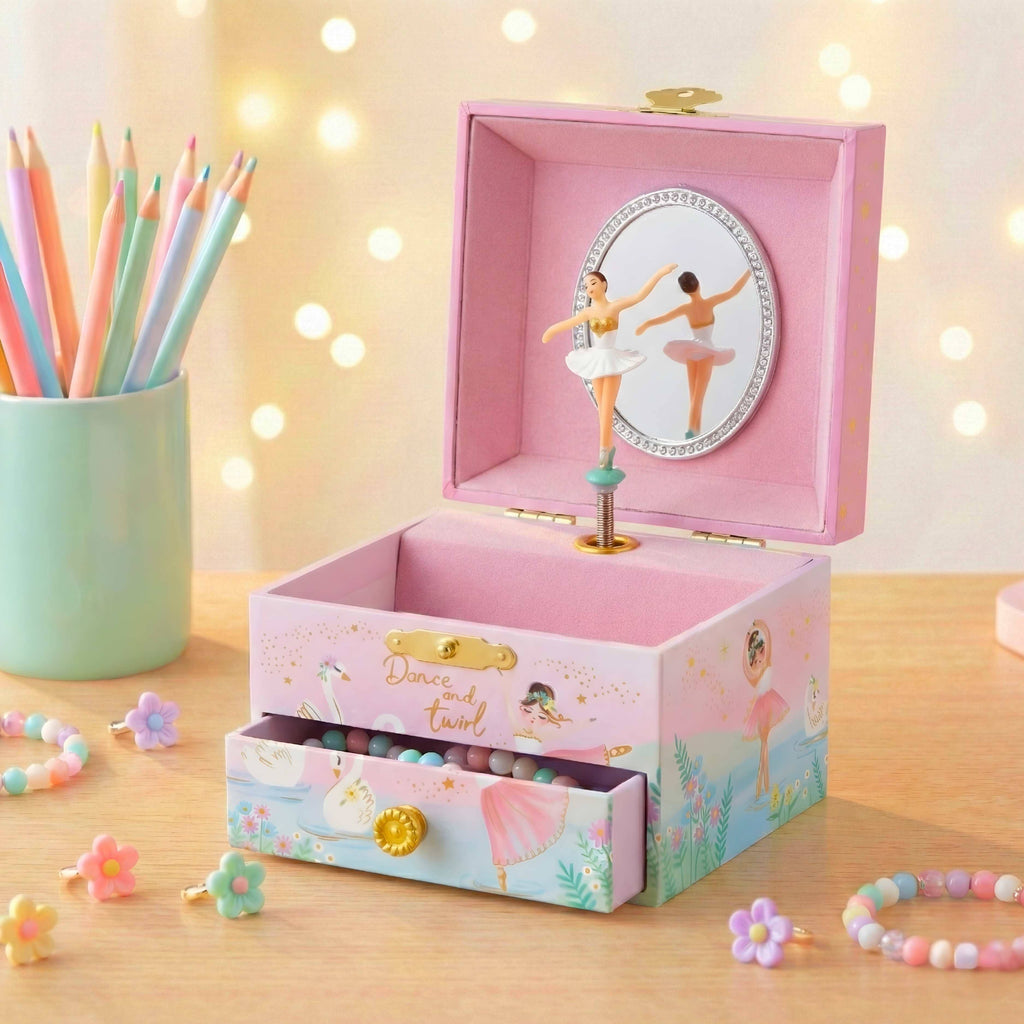 Pink music box with spinning ballerina, drawer, storage, mirror, and jewelry box.