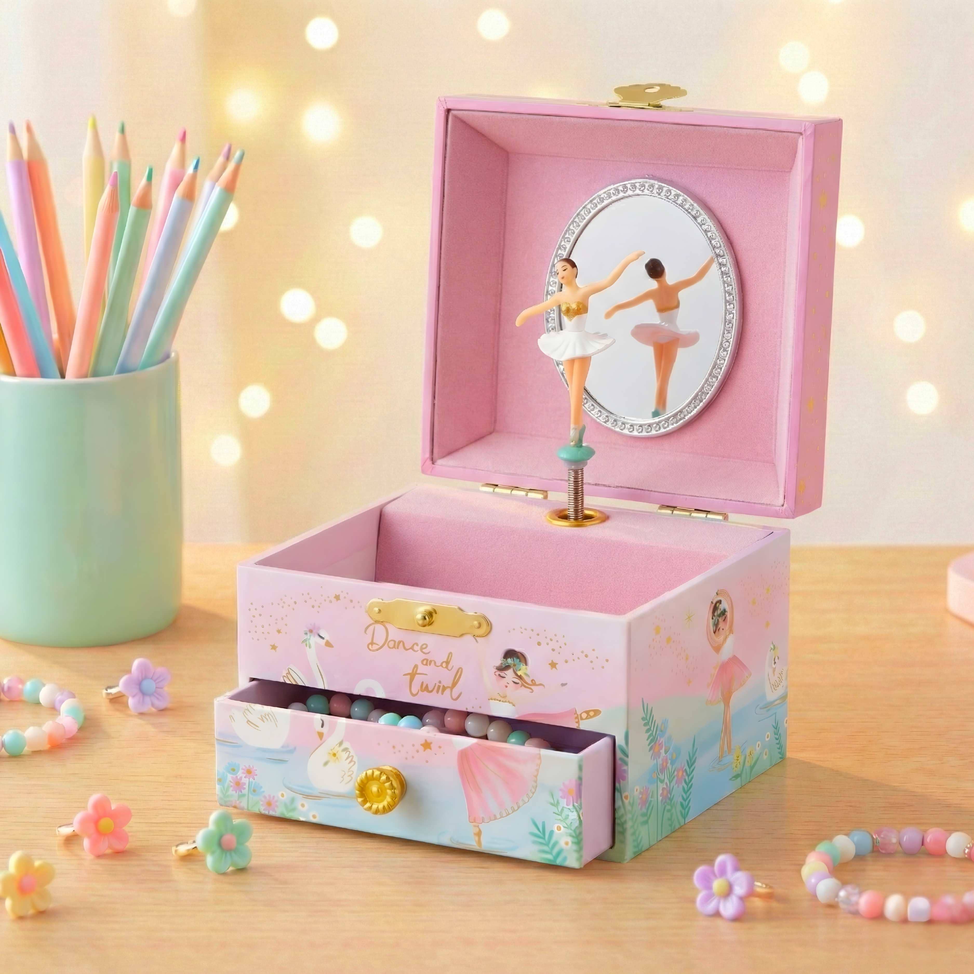 Pink music box with spinning ballerina, drawer, storage, mirror, and jewelry box.