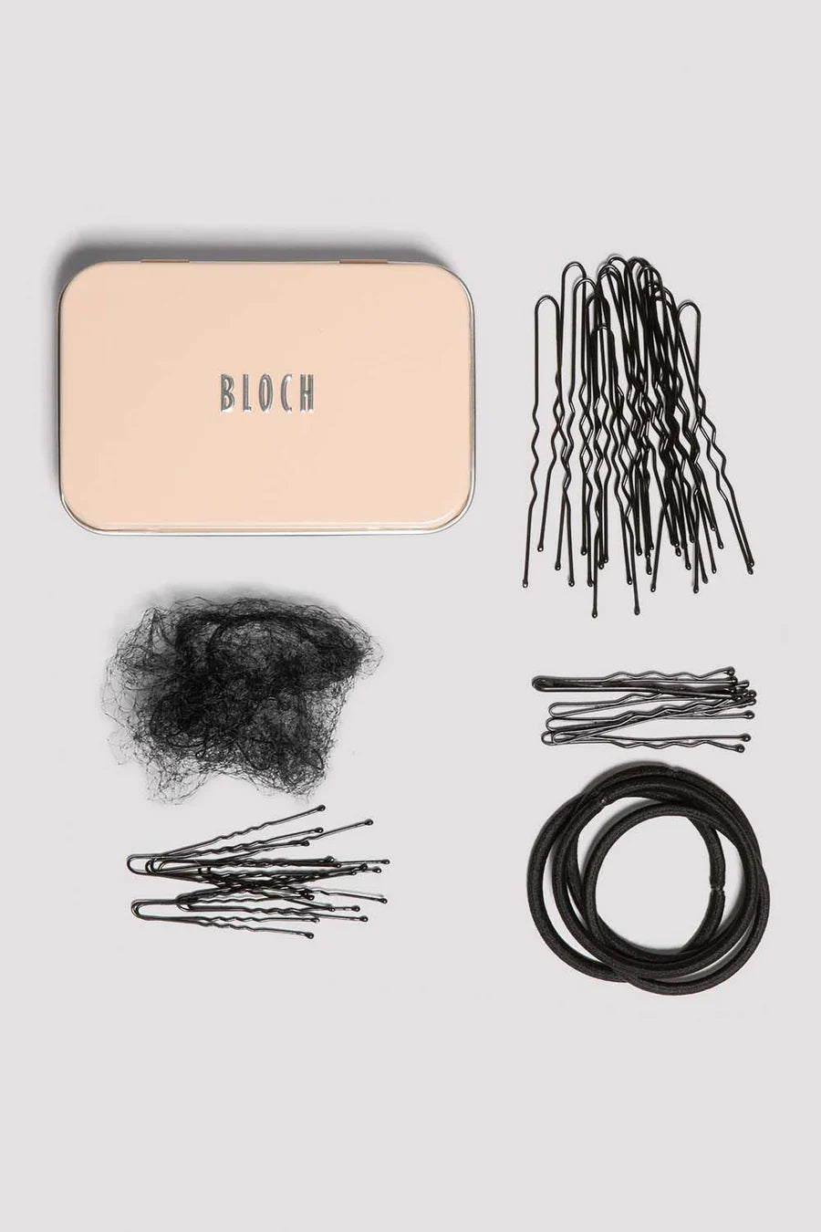 Collection of black hair accessories including bobby pins, hair ties, and a beige container labeled 'BLOCH' on a light gray background.