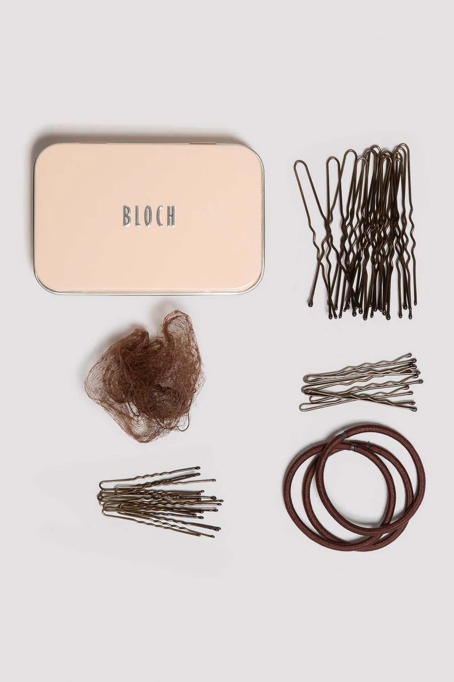 Collection of brown hair accessories including bobby pins, hair ties, and a beige container labeled BLOCH on a light gray background.