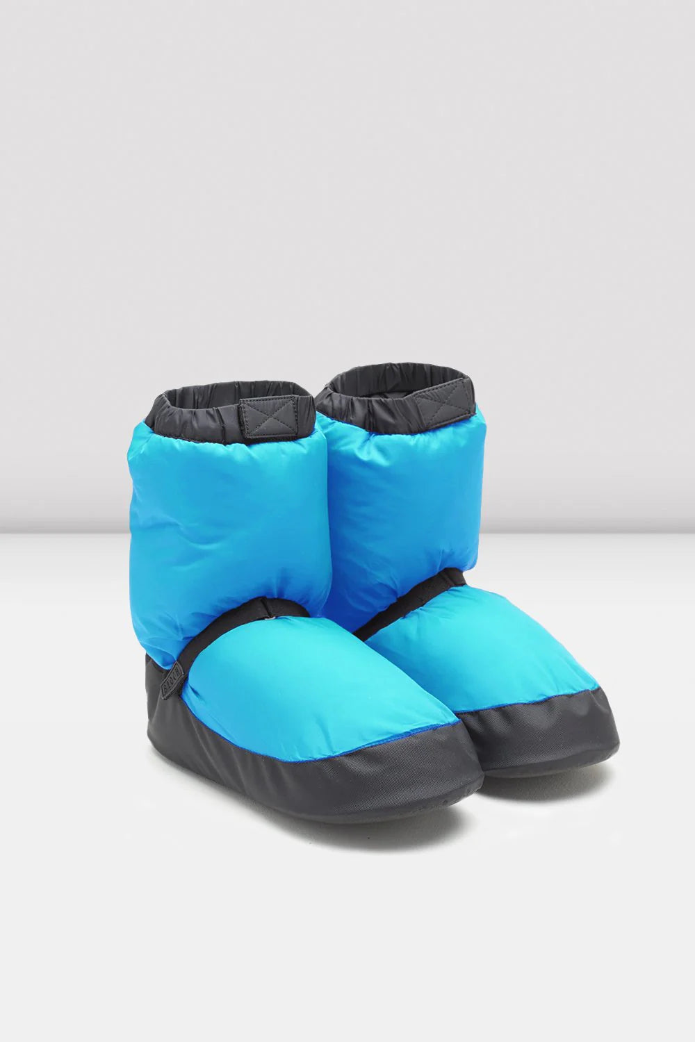 Blue and black winter booties on a white background