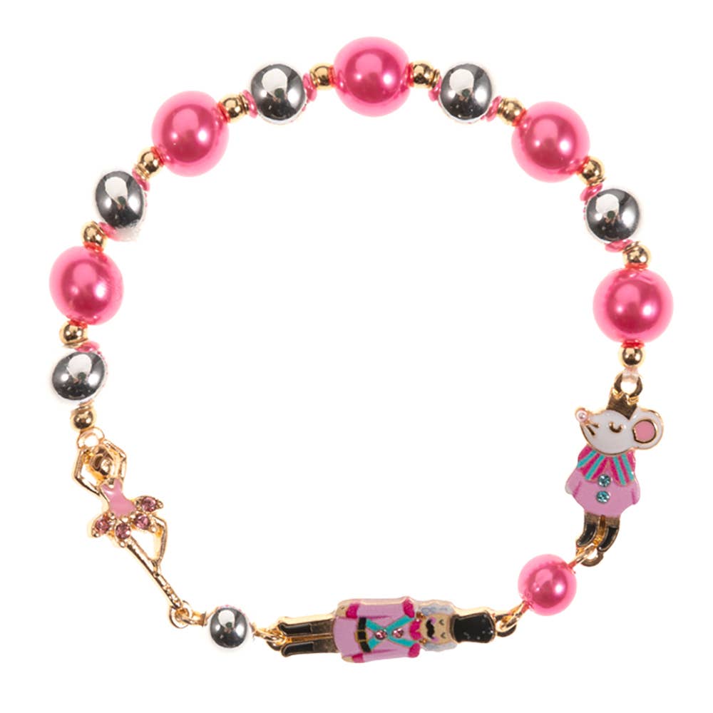 Faire C6B2649 Influence gold bracelet with pink and silver beads with a ballerina, mouse, and nutcracker figure.