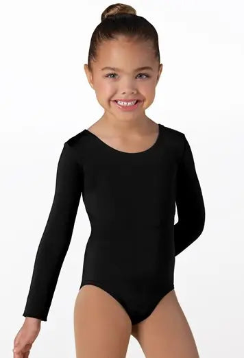 Young girl wearing a black long-sleeve leotard on a white background